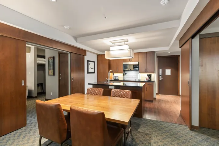 Dining area with dark colored carpet