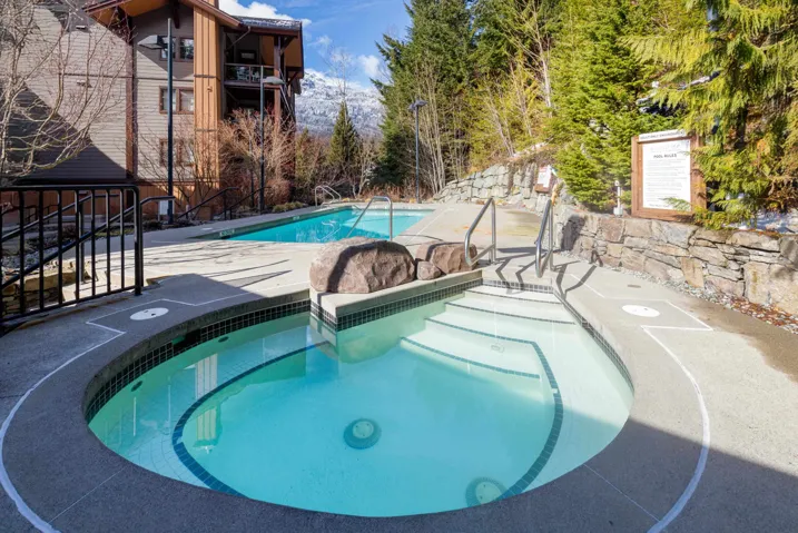 Community pool with a hot tub