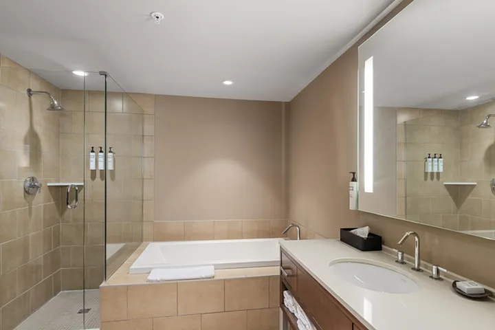 Full bathroom featuring vanity, a bath, recessed lighting, and a stall shower