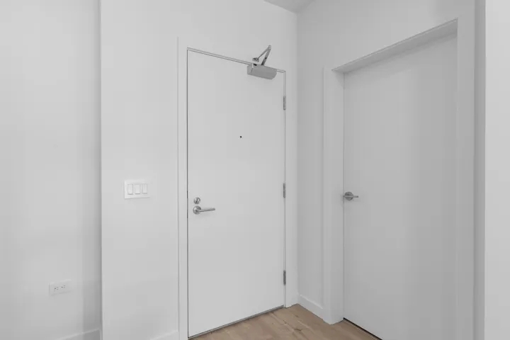 Hallway with light wood-type flooring