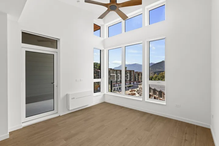Unfurnished sunroom featuring a mountain view