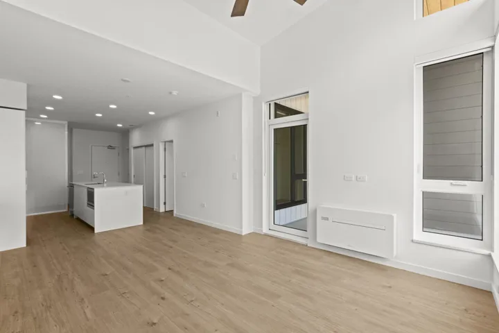 Unfurnished living room featuring light wood-style flooring, ceiling fan, and recessed lighting
