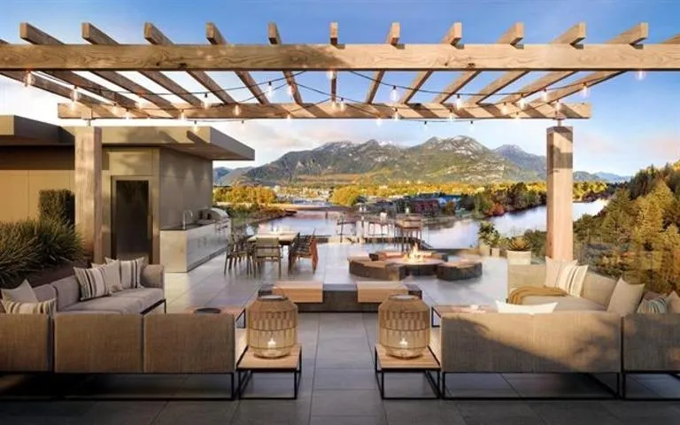 View of patio / terrace featuring an outdoor living space with a fire pit, a pergola, and a water and mountain view