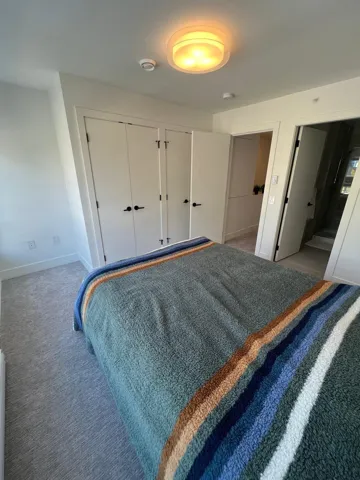 Bedroom featuring a closet and carpet