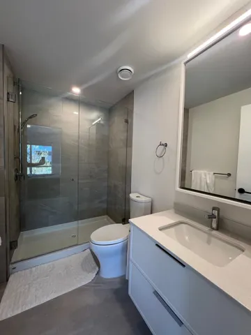 Full bathroom featuring vanity and a stall shower