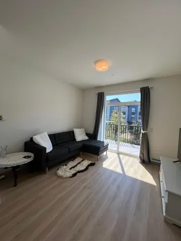 Living area featuring light wood-style floors