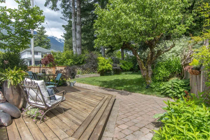 Wooden terrace with outdoor dining area and a mountain view