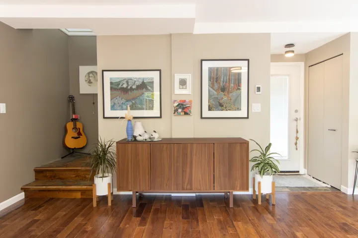 Foyer entrance featuring dark wood finished floors and baseboards