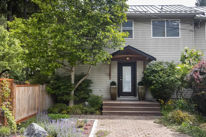View of front of house featuring a standing seam roof and metal roof