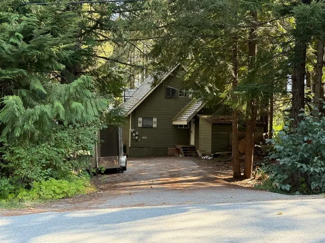 View of home's exterior with driveway and entry steps