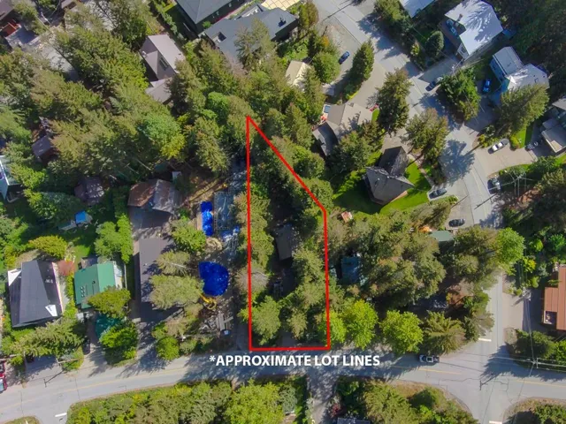 Aerial perspective of suburban area featuring property boundaries highlighted