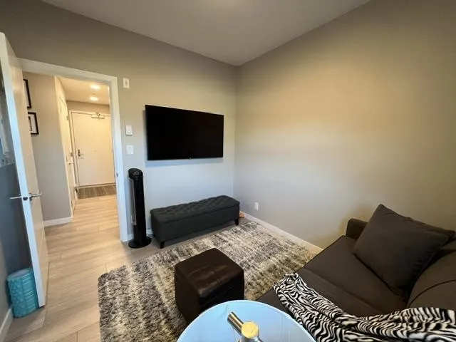 Neutral tone walls complement light wood-finish flooring