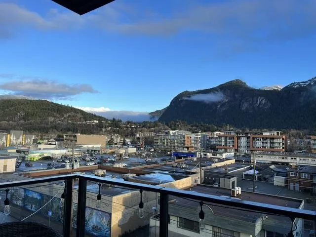 Expansive mountain scenery with residential and commercial buildings