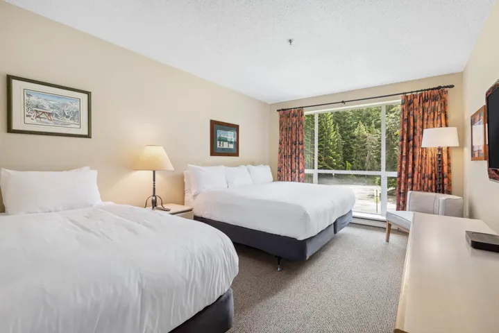 Carpeted bedroom featuring a textured ceiling
