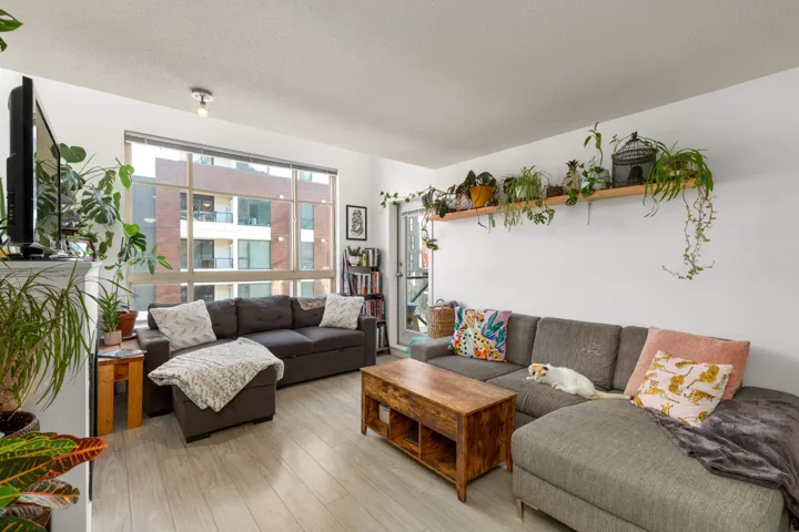 Living room featuring wood finished floors and a textured ceiling