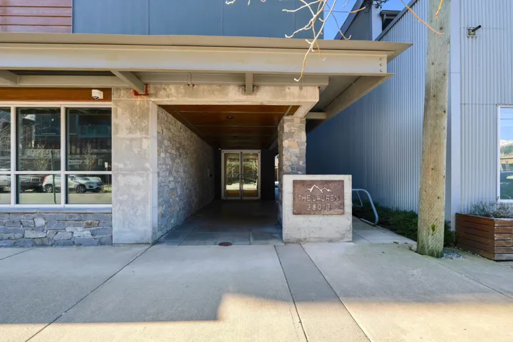 Property entrance with stone siding