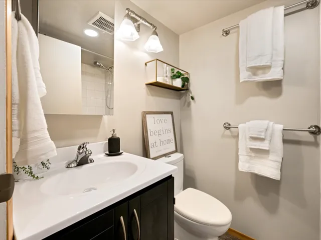 Bathroom with vanity and a shower