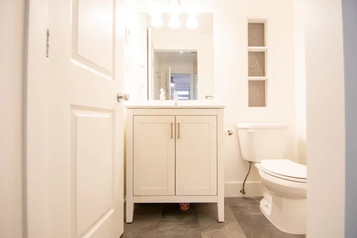 Half bath featuring vanity and toilet