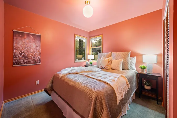 Bedroom featuring baseboards and carpet