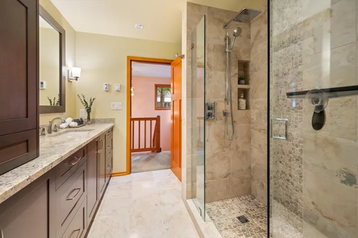 Renovated Bathroom with vanity and a shower stall