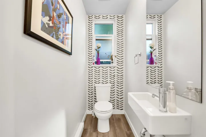 Bathroom featuring toilet and wood finished floors
