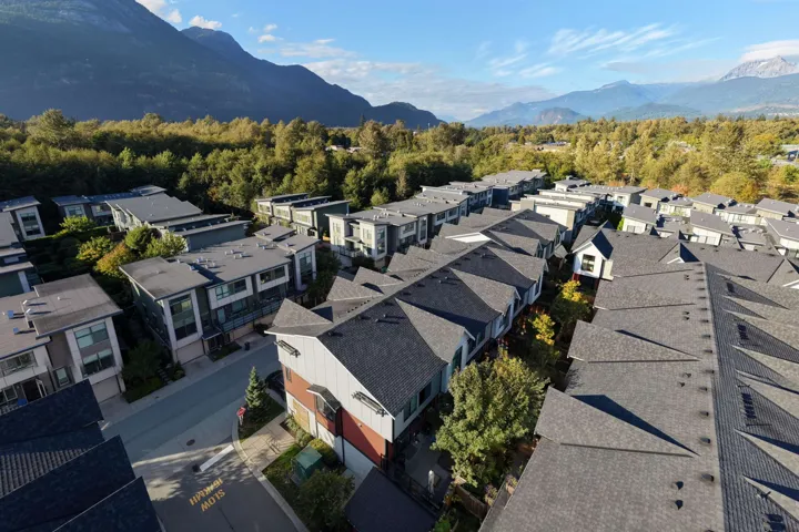 Aerial perspective of suburban area featuring a mountain backdrop