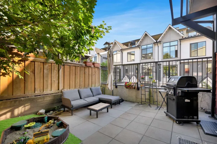 View of patio with a grill and an outdoor living space