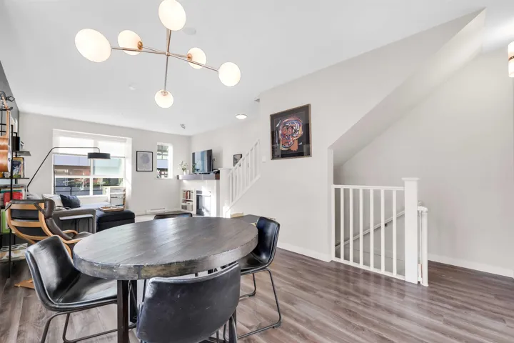 Dining space featuring stairs and wood finished floors
