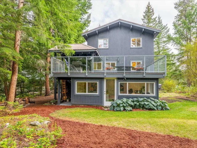 Back of house featuring a patio area and a lawn