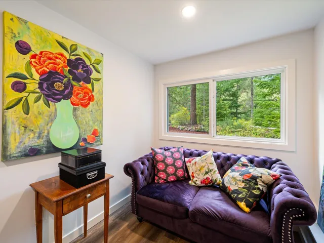 Living room featuring wood finished floors and recessed lighting