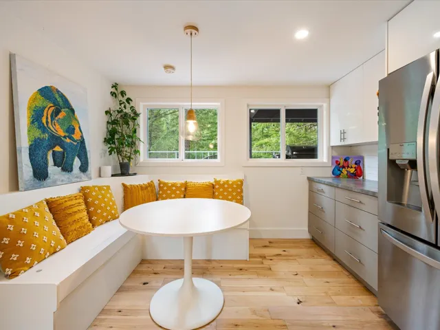 Dining space with breakfast area, light wood-style flooring, plenty of natural light, and recessed lighting