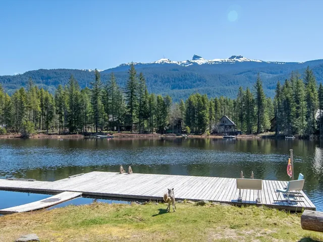 Dock area featuring a water and mountain view and a forest view