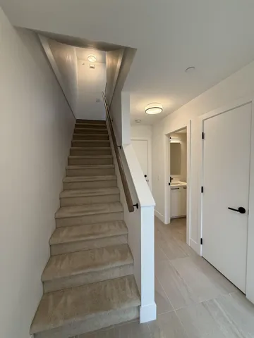 Stairs with tile patterned flooring