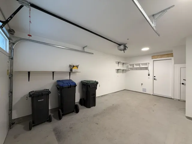 Garage featuring a garage door opener