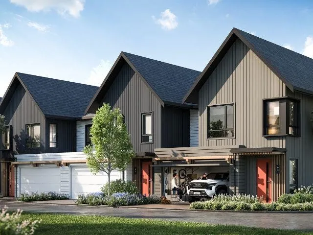 Contemporary townhome exteriors featuring vertical siding and dark-trimmed windows