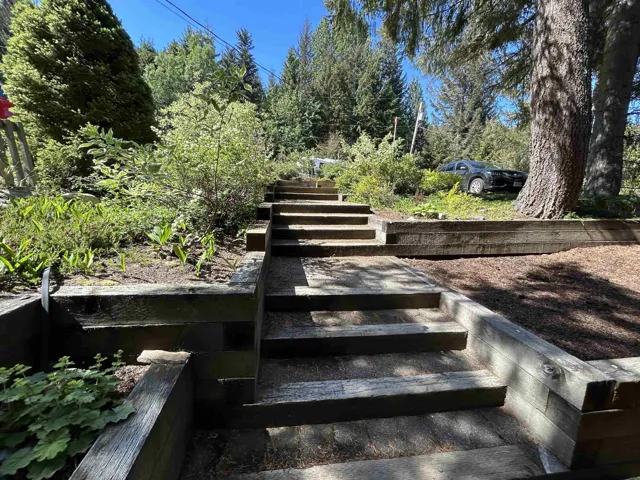 Tiered outdoor staircase with timber retaining walls