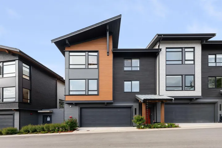 View of property with an attached garage