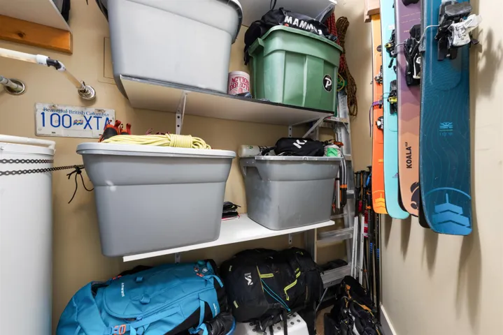 Hot water tank room with built-in storage - ski/board racks, shelving, possibility for bikes. Dimensions 3'10" x9'3"
