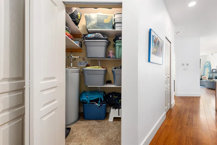 Hot water tank room with built-in storage - ski/board racks, shelving, possibility for bikes. Dimensions 3'10" x9'3"