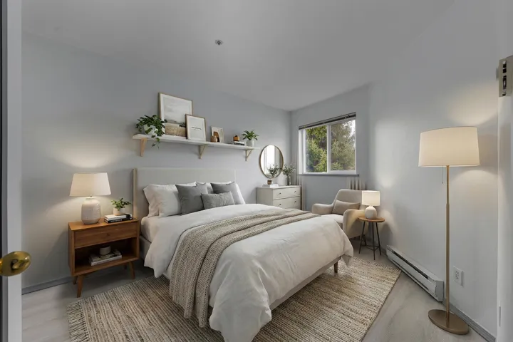 Bedroom featuring a baseboard heating unit
