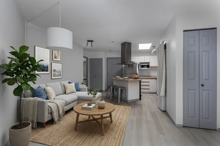 Living room with light wood finished floors and baseboards