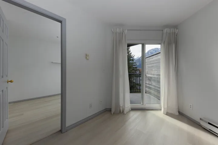 Spare room featuring light wood-style flooring and baseboard heating