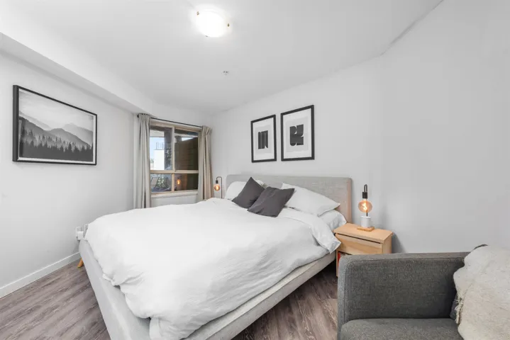 Bedroom with baseboards and wood finished floors