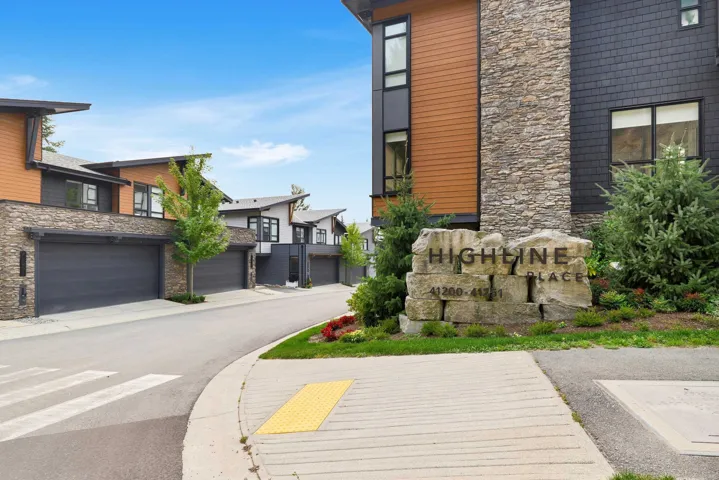View of asphalt road featuring a residential view and a mountain view