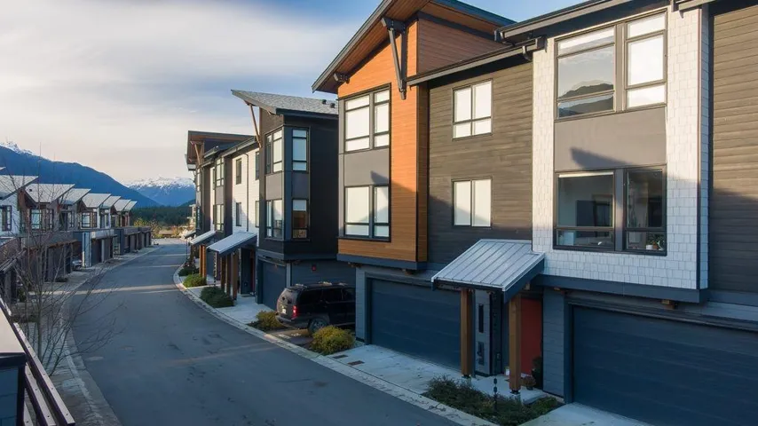 View of asphalt road featuring a mountain view and a residential view
