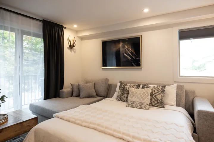 Bedroom featuring access to outside and recessed lighting