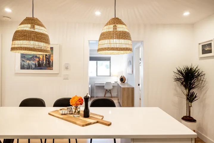 Interior space with recessed lighting and hanging light fixtures