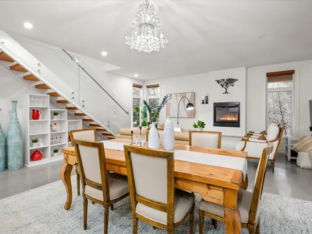 Dining room with recessed lighting, finished concrete flooring, and stairs