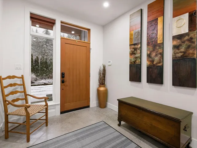 Entryway with recessed lighting and baseboards