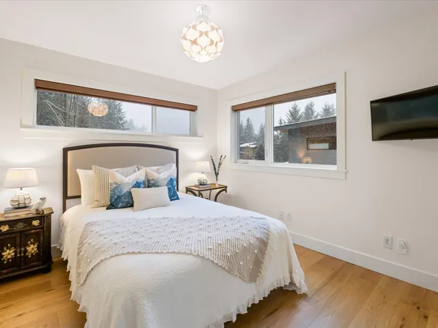 Bedroom with light wood-style floors and baseboards